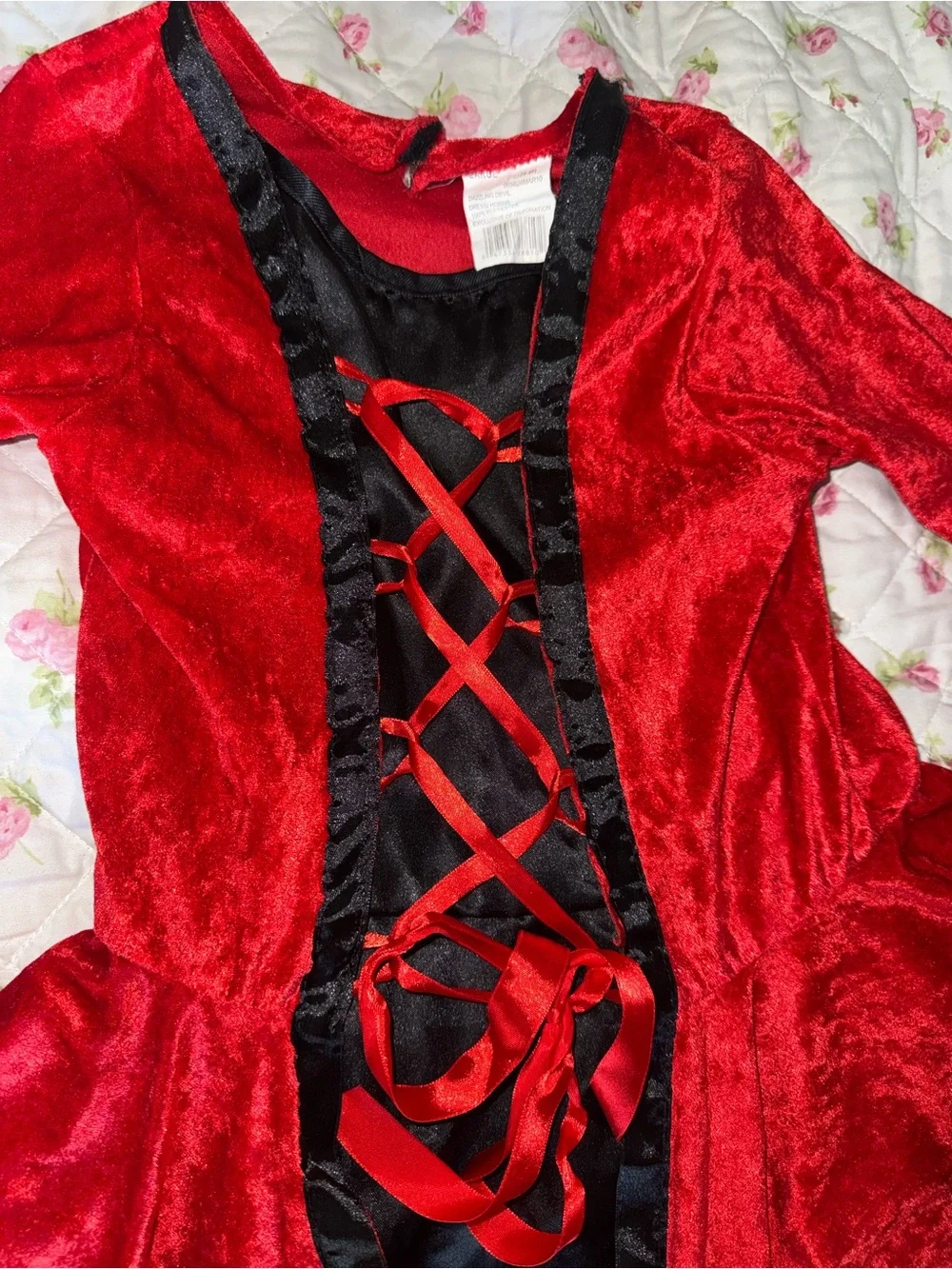 Red velvet dress with black trim and lace-up front, size L